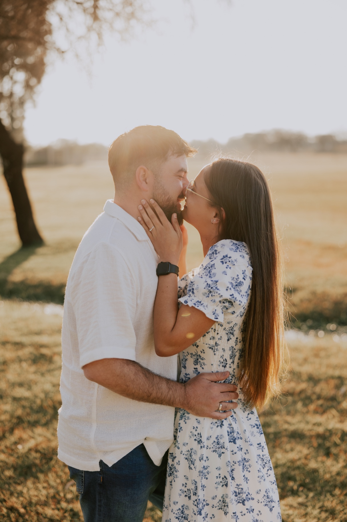 Megan and Dylan embracing at golden hour